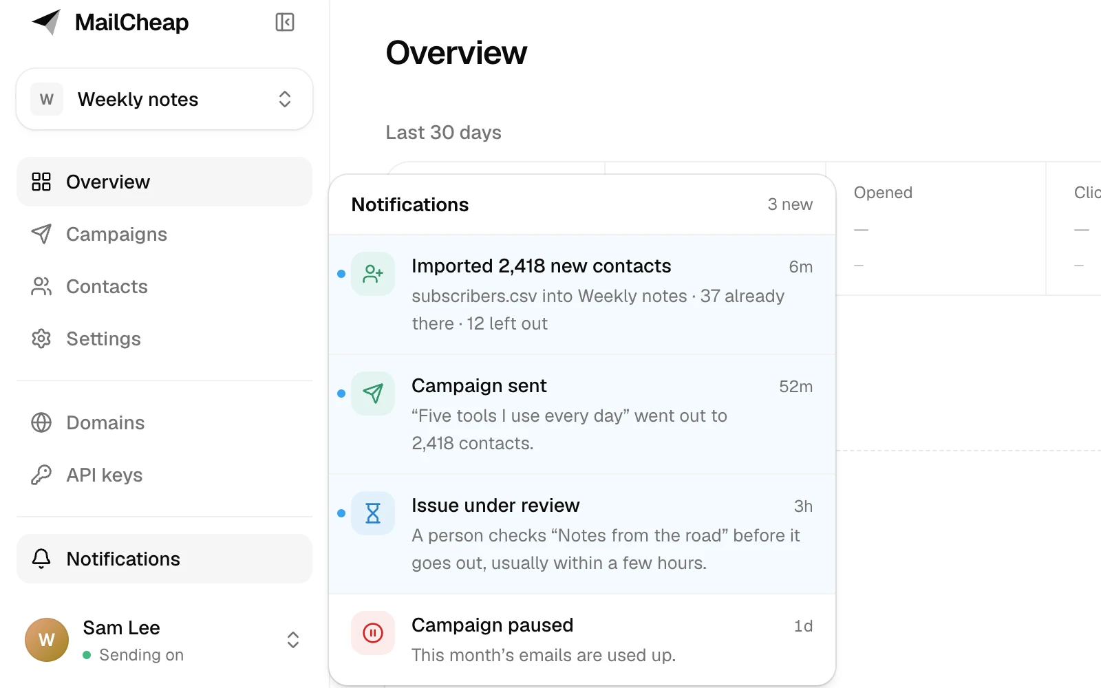 The notifications open beside the sidebar's Notifications section: an import, a sent campaign and an issue under review marked new, above a paused campaign.